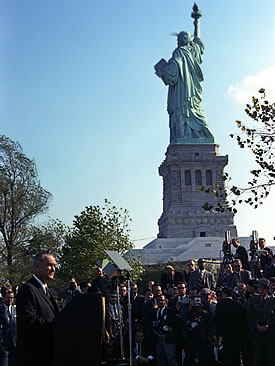 Lyndon B. Johnson speaking on Immigration Acto of 1965 near Statue of Liberty