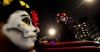 Mexicans don skeleton disguises for a pre-Day of the Dead parade