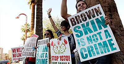 Arizona SB 1070 protestors holding signs