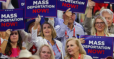 Mass deportation signs held by white people at Trump rally