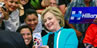 Crowd of Latinas with Hillary Clinton taking selfie